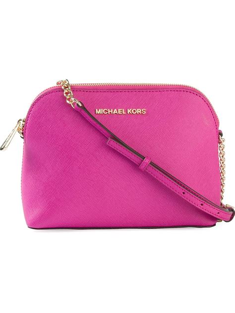 pink cross body bag michael kors oval round|Michael Kors pink suitcase.